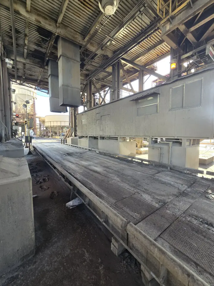 Truck scale with silos and office around causing challenges to properly clean out